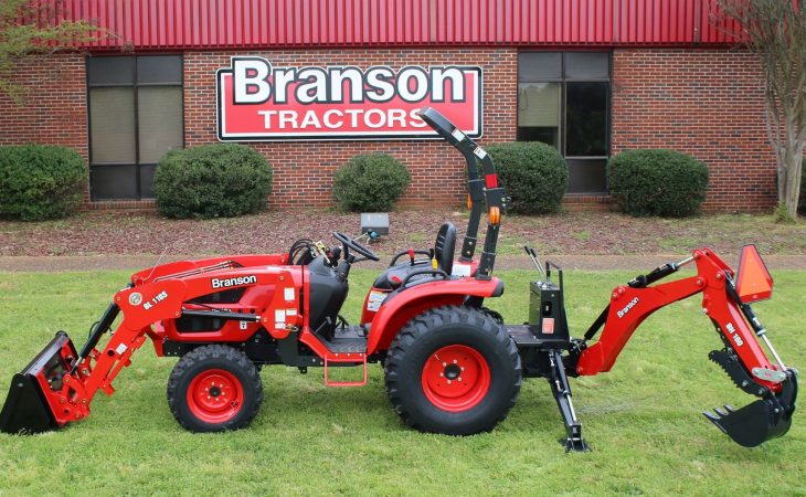 left-side view of Branson 2610 Tractor with backhoe attached