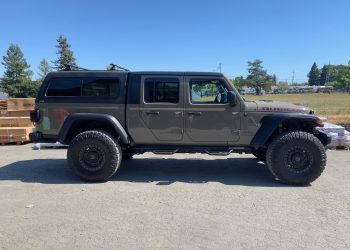 Jeep Rubicon with hard top truck cap