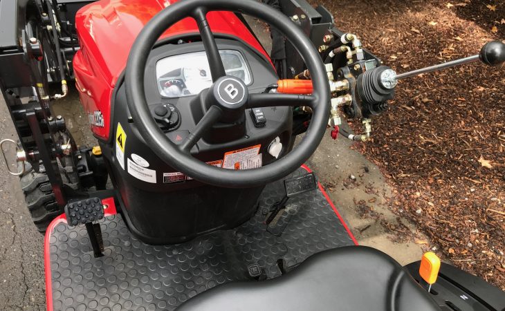 behind-the-wheel view of Branson 2205 Tractor controls and gauges