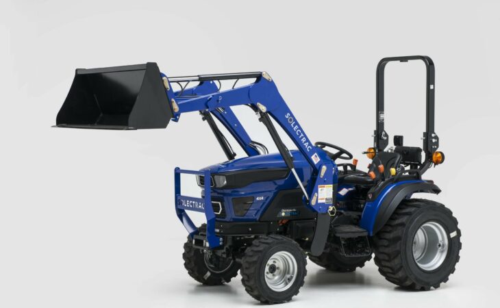 Solectrac e25 compact electric tractor with its lifter raised