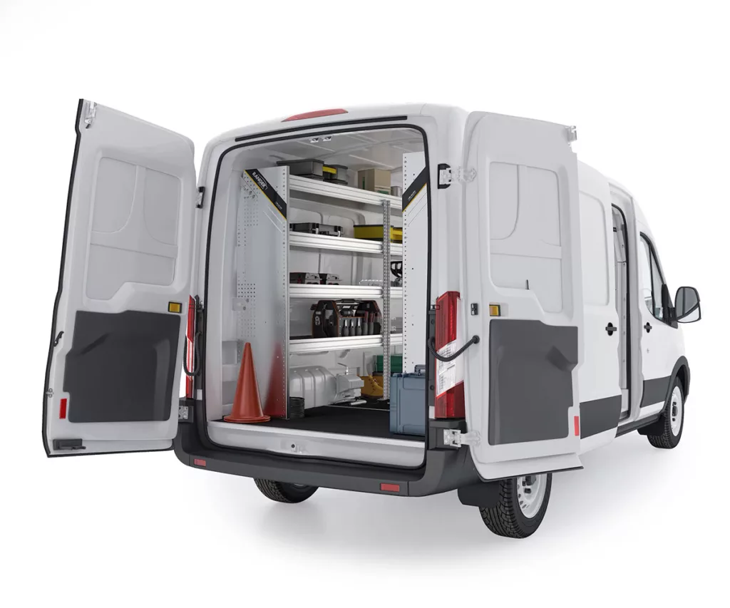 A Ford Transit van has its back doors open, displaying Ranger Design's aluminum van shelving system.