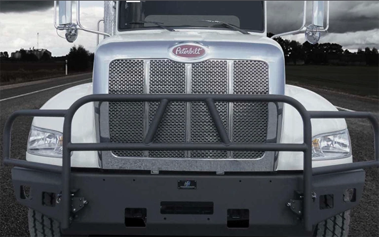 Close up of a semi truck with a HammerHead Armor XD series front bumper