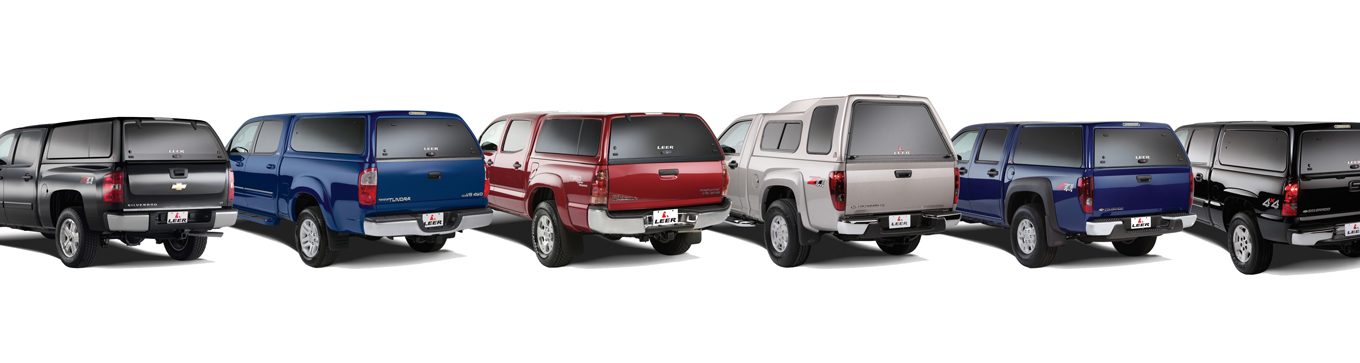 Multiple pickup trucks equipped with leer brand camper shells